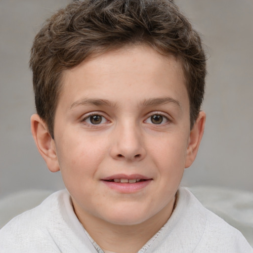 Joyful white child male with short  brown hair and brown eyes