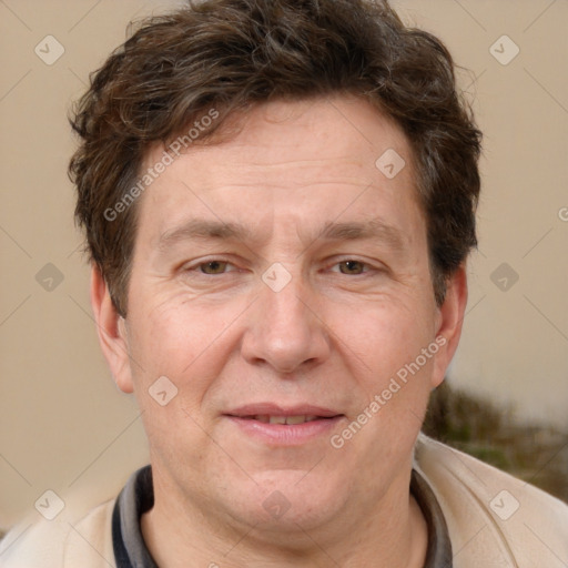 Joyful white middle-aged male with short  brown hair and brown eyes