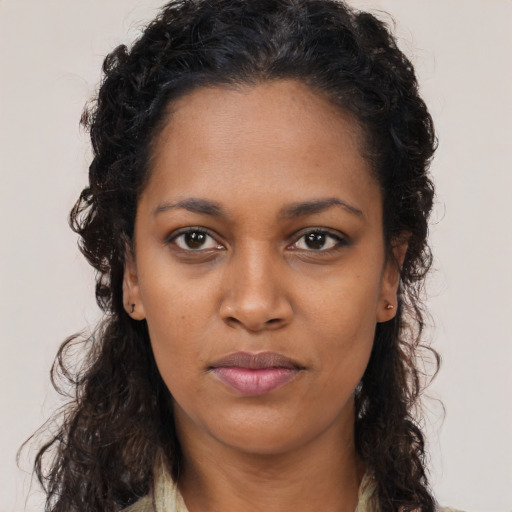 Neutral black young-adult female with long  brown hair and brown eyes