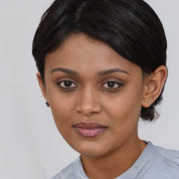 Joyful asian young-adult female with medium  black hair and brown eyes