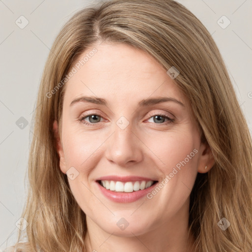 Joyful white young-adult female with long  brown hair and grey eyes