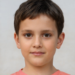 Joyful white child male with short  brown hair and brown eyes