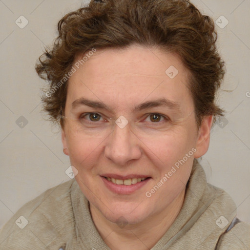 Joyful white adult female with short  brown hair and blue eyes