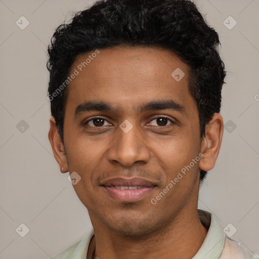 Joyful black young-adult male with short  black hair and brown eyes