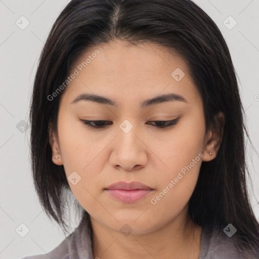 Joyful asian young-adult female with long  brown hair and brown eyes