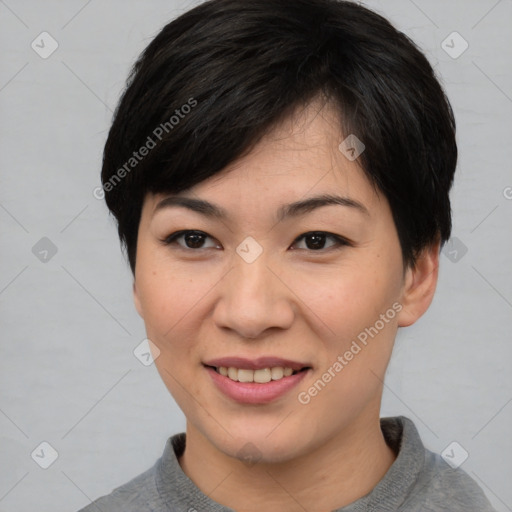 Joyful asian young-adult female with short  brown hair and brown eyes