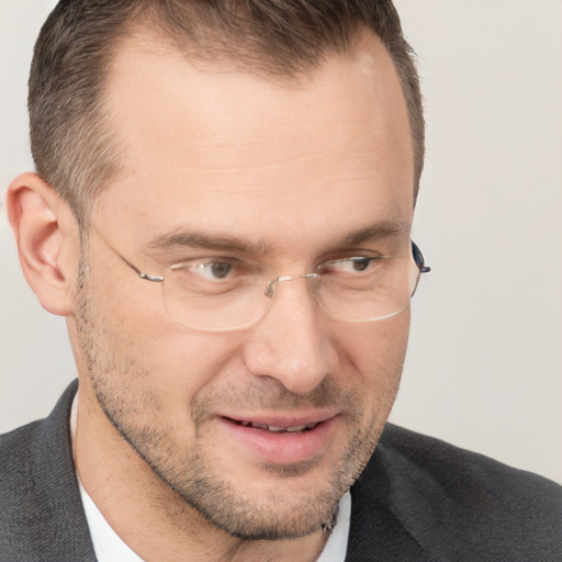 Joyful white adult male with short  brown hair and brown eyes