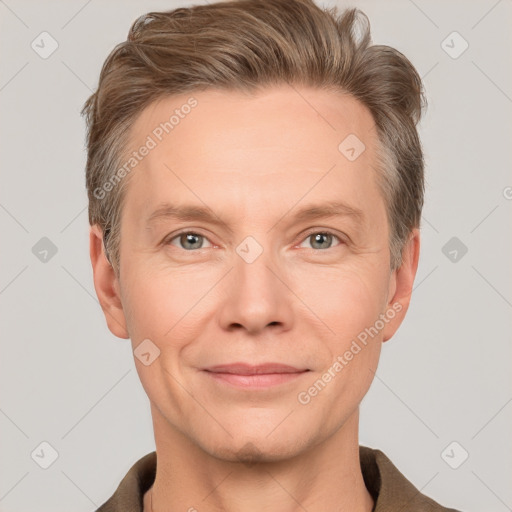 Joyful white adult male with short  brown hair and grey eyes