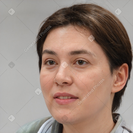 Joyful white adult female with medium  brown hair and brown eyes