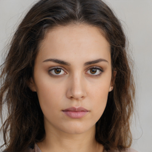 Neutral white young-adult female with long  brown hair and brown eyes