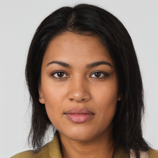 Neutral latino young-adult female with long  brown hair and brown eyes