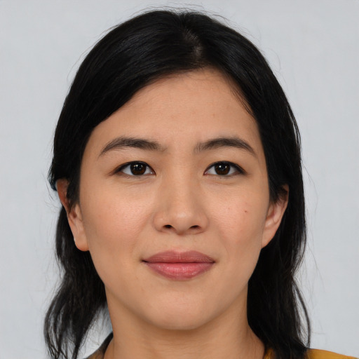 Joyful asian young-adult female with medium  black hair and brown eyes