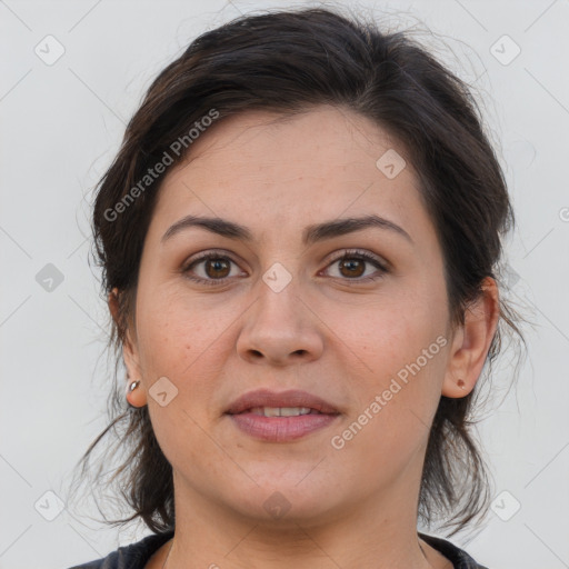 Joyful white young-adult female with medium  brown hair and brown eyes