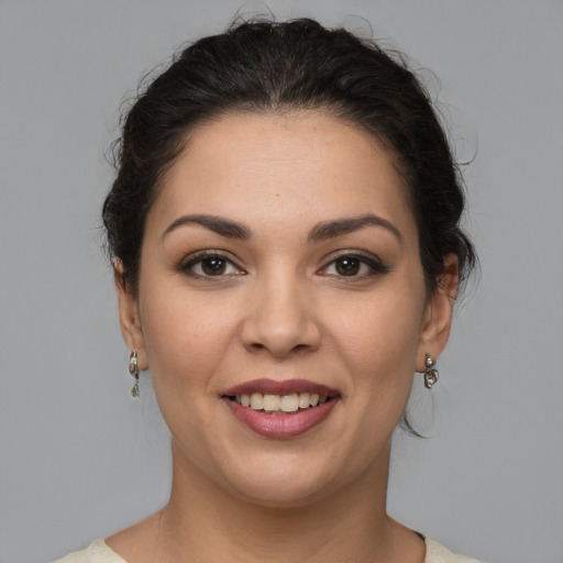 Joyful white young-adult female with medium  brown hair and brown eyes