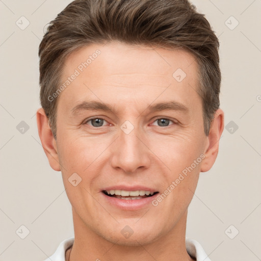 Joyful white adult male with short  brown hair and brown eyes