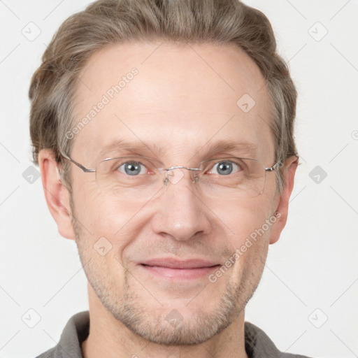 Joyful white adult male with short  brown hair and grey eyes