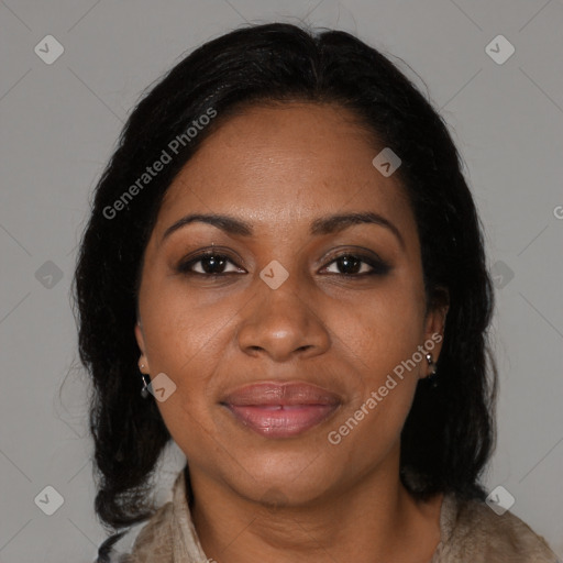 Joyful black adult female with medium  brown hair and brown eyes