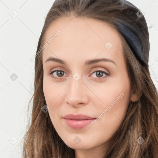 Neutral white young-adult female with long  brown hair and brown eyes