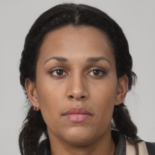 Neutral latino young-adult female with long  brown hair and brown eyes
