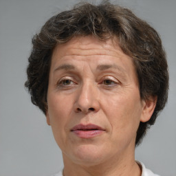 Joyful white middle-aged female with medium  brown hair and brown eyes