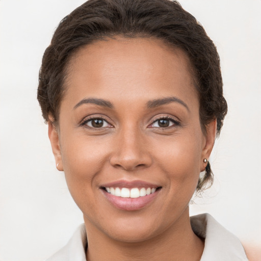 Joyful white young-adult female with short  brown hair and brown eyes