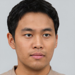 Neutral asian young-adult male with short  brown hair and brown eyes