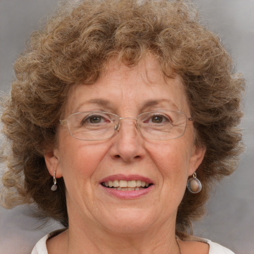 Joyful white middle-aged female with medium  brown hair and brown eyes