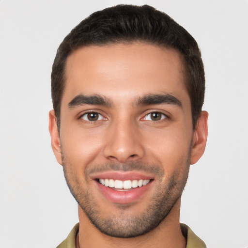 Joyful white young-adult male with short  brown hair and brown eyes