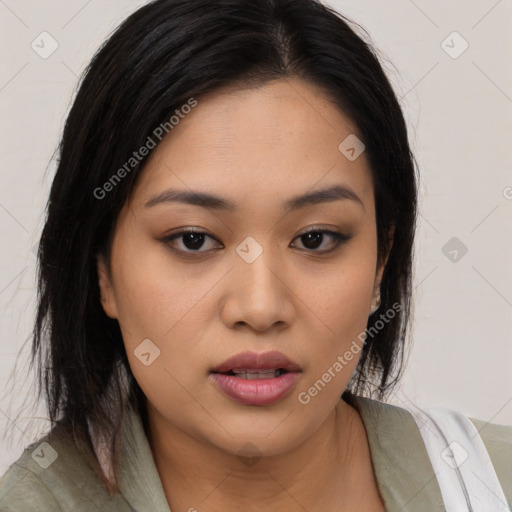 Joyful asian young-adult female with medium  black hair and brown eyes