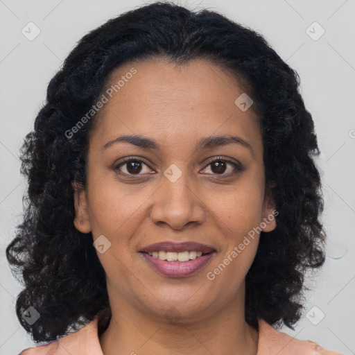 Joyful black young-adult female with long  brown hair and brown eyes