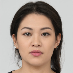 Joyful asian young-adult female with medium  brown hair and brown eyes