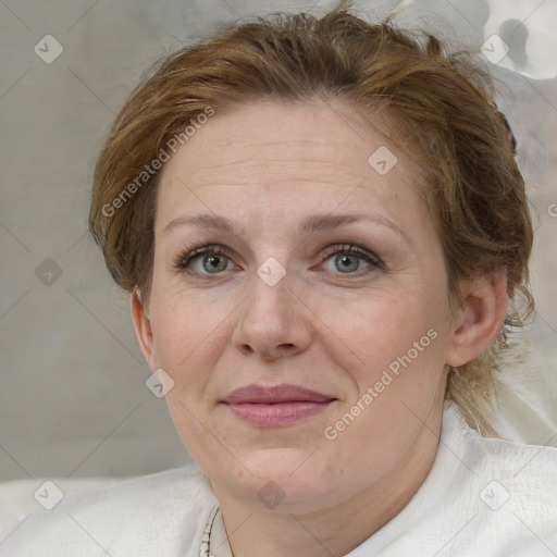 Joyful white adult female with medium  brown hair and blue eyes