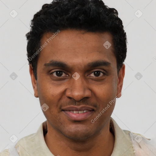 Joyful black young-adult male with short  black hair and brown eyes