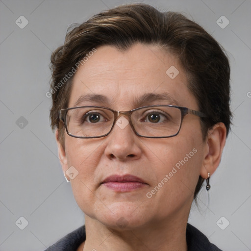 Joyful white adult female with short  brown hair and grey eyes