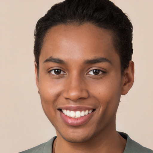 Joyful black young-adult male with short  brown hair and brown eyes