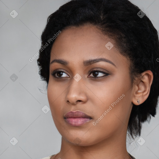 Neutral black young-adult female with medium  black hair and brown eyes