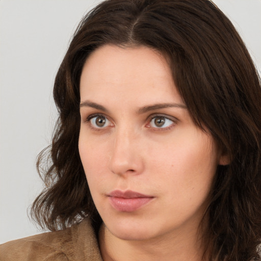 Neutral white young-adult female with long  brown hair and brown eyes