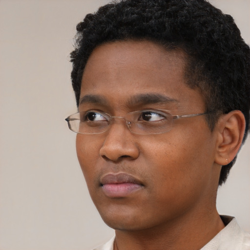 Neutral black young-adult male with short  black hair and brown eyes