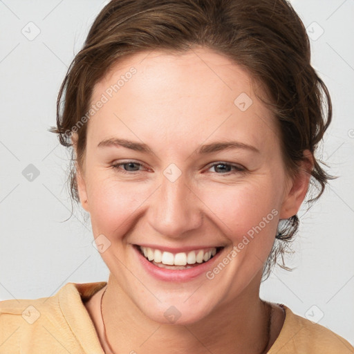 Joyful white young-adult female with medium  brown hair and grey eyes