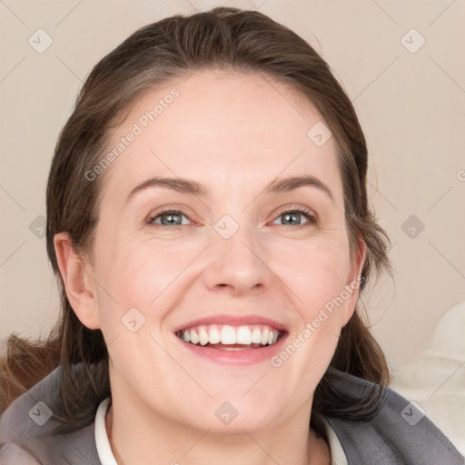 Joyful white young-adult female with medium  brown hair and blue eyes