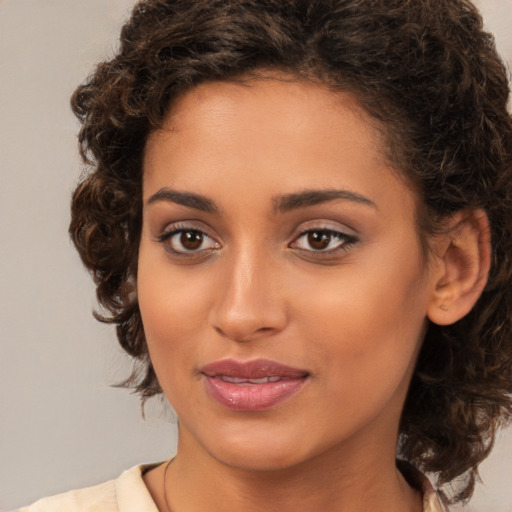 Joyful white young-adult female with medium  brown hair and brown eyes