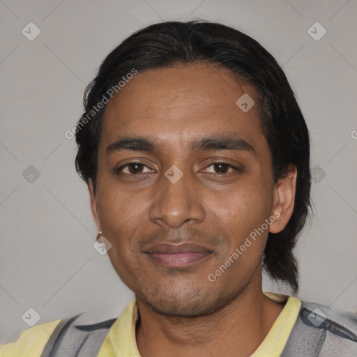 Joyful black adult male with short  black hair and brown eyes