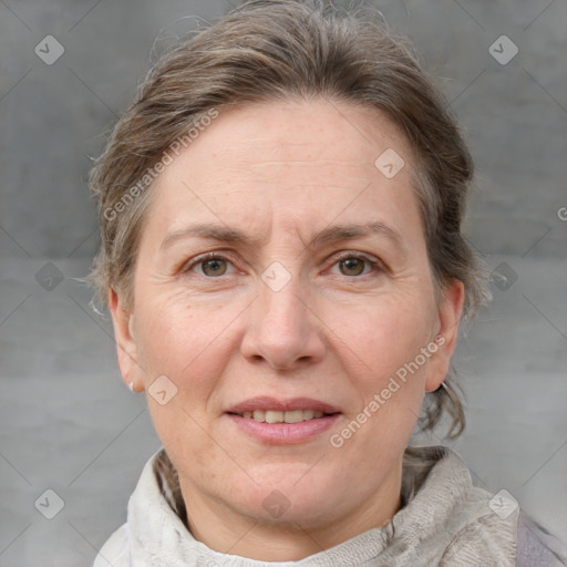 Joyful white adult female with medium  brown hair and grey eyes