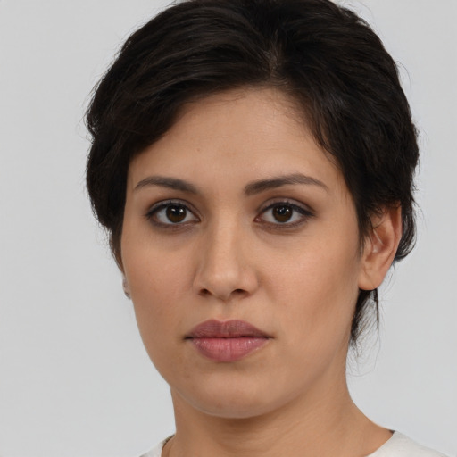 Joyful white young-adult female with short  brown hair and brown eyes