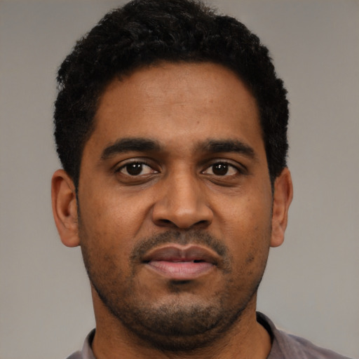 Neutral black young-adult male with short  black hair and brown eyes