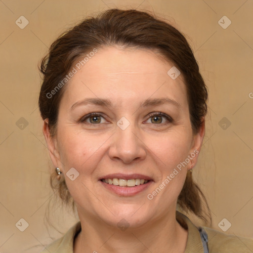 Joyful white adult female with medium  brown hair and grey eyes