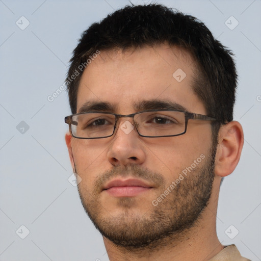 Neutral white young-adult male with short  black hair and brown eyes