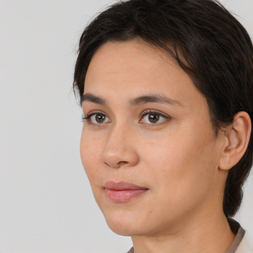 Neutral white young-adult female with long  brown hair and brown eyes