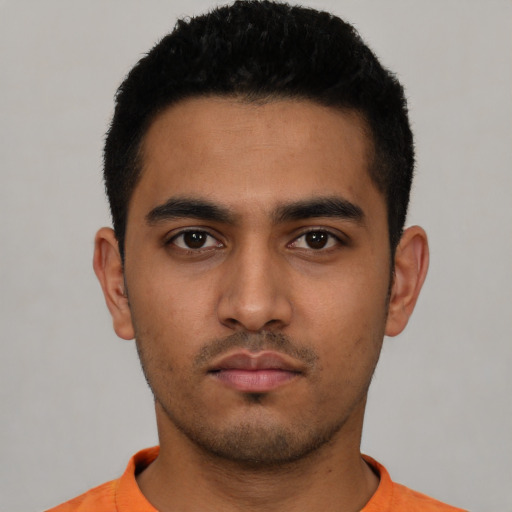 Neutral latino young-adult male with short  black hair and brown eyes