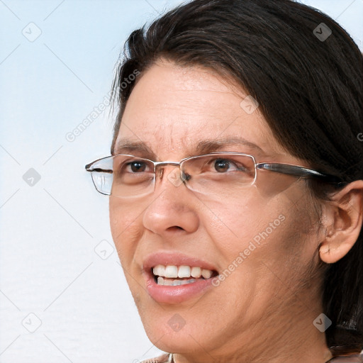 Joyful white adult female with long  brown hair and brown eyes